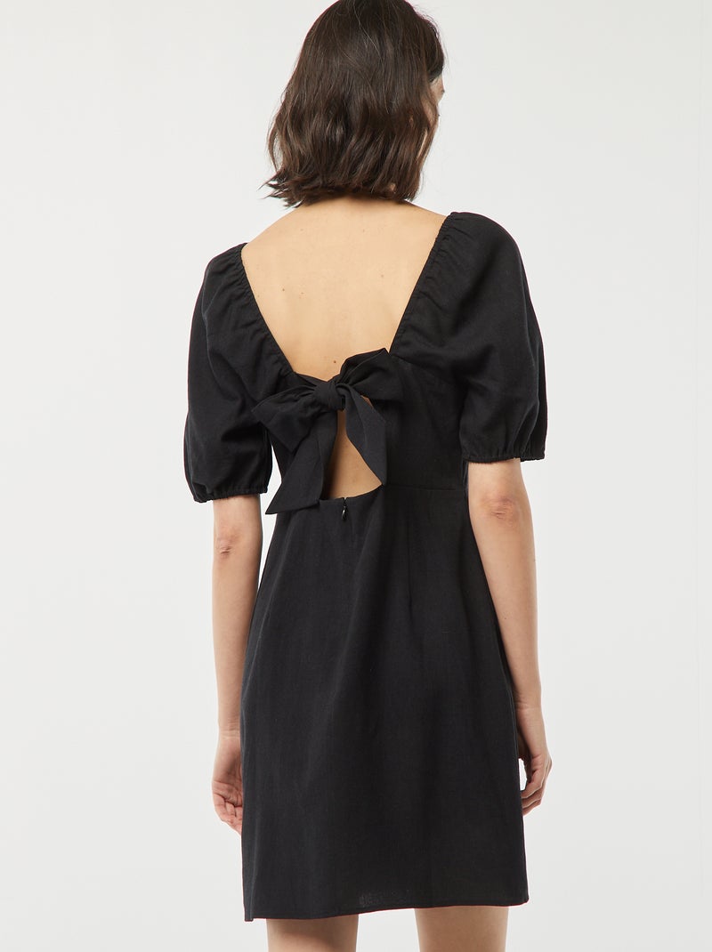 Robe courte évasée avec ouverture par un nœud au dos noir - Kiabi