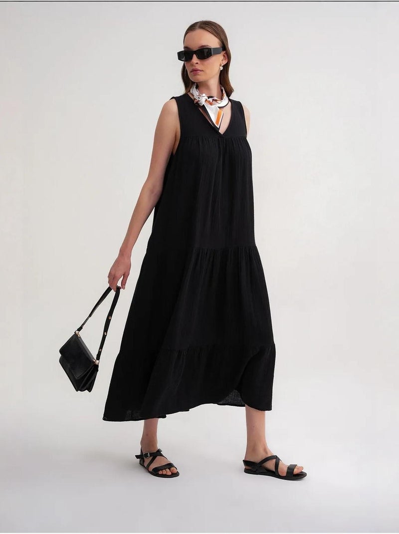 Robe mi-longue en mousseline sans manches à col en v et poches mixray Noir - Kiabi