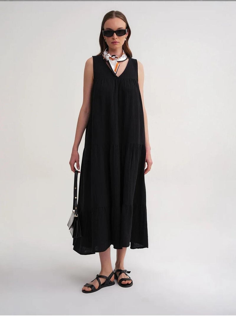 Robe mi-longue en mousseline sans manches à col en v et poches mixray Noir - Kiabi
