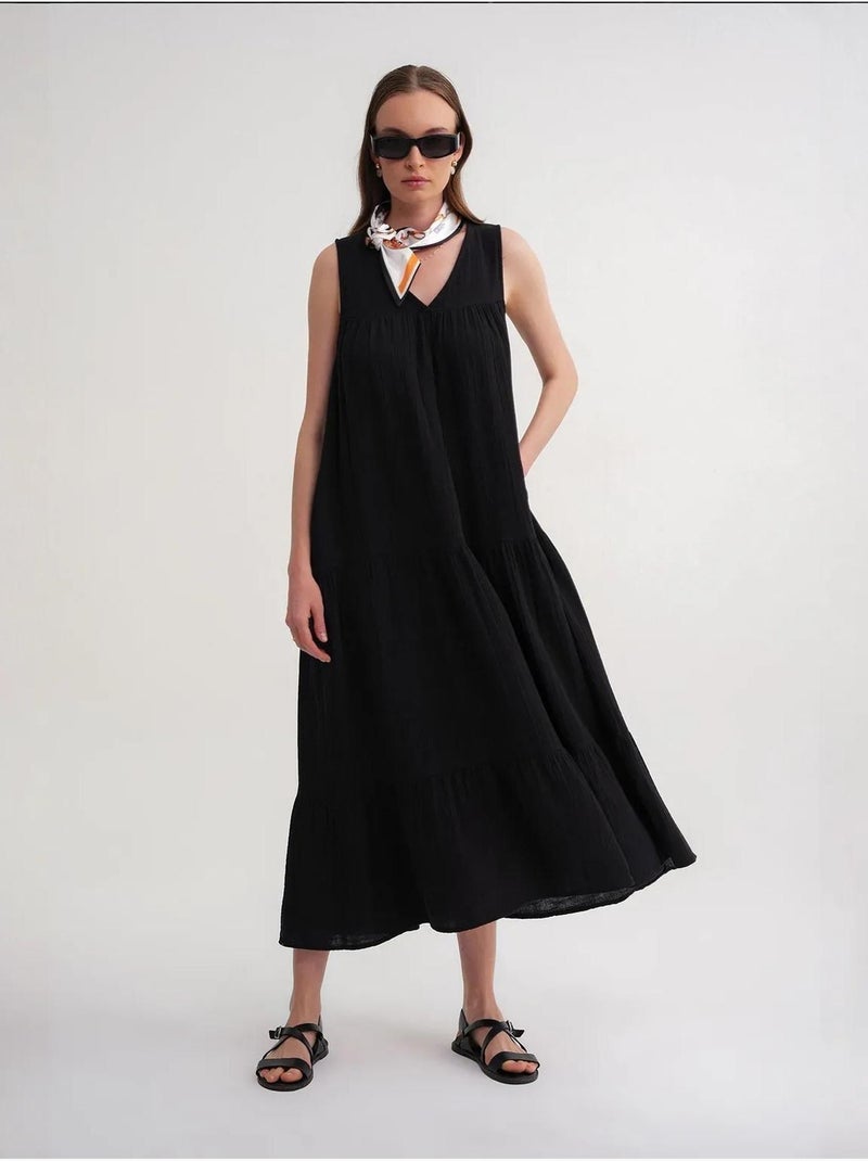 Robe mi-longue en mousseline sans manches à col en v et poches mixray Noir - Kiabi