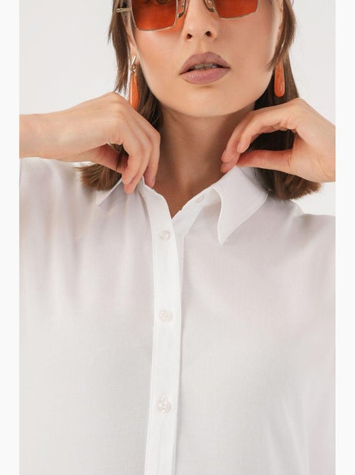 Robe midi boutonnée sans manches avec col chemise bdart - Kiabi Robe midi boutonnée sans manches avec col chemise bdart - Kiabi
