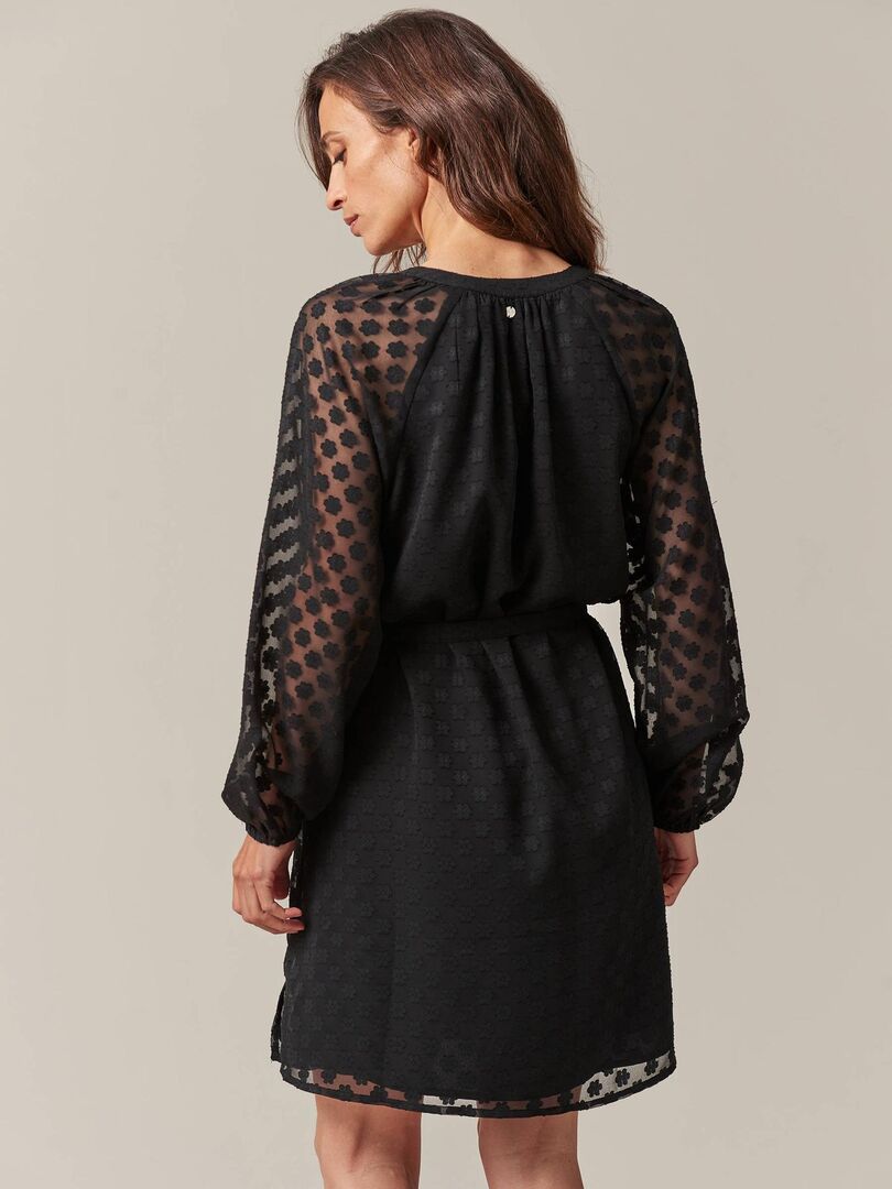 Le Top Femme Noire Chic à Manches Transparentes à Pois