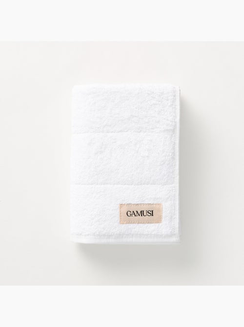 Serviette 100 % coton, éponge 600 g/m², avec boucle de suspension - Gamusi - Kiabi Serviette 100 % coton, éponge 600 g/m², avec boucle de suspension - Gamusi - Kiabi
