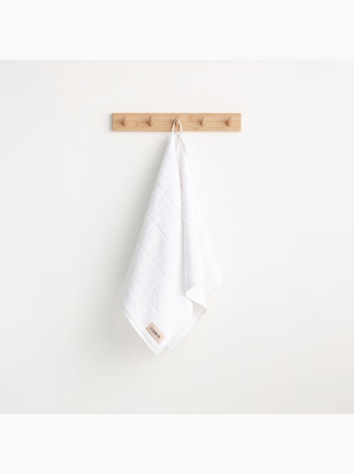 Serviette 100 % coton, éponge 600 g/m², avec boucle de suspension - Gamusi - Kiabi Serviette 100 % coton, éponge 600 g/m², avec boucle de suspension - Gamusi - Kiabi