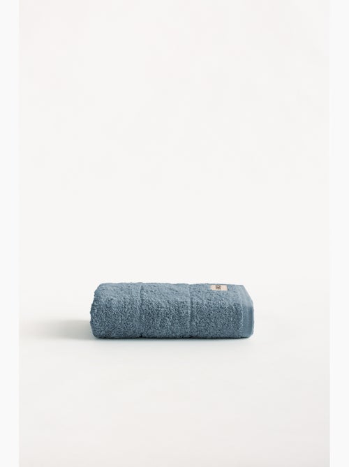 Serviette 100 % coton, éponge 600 g/m², avec boucle de suspension - Gamusi - Kiabi Serviette 100 % coton, éponge 600 g/m², avec boucle de suspension - Gamusi - Kiabi