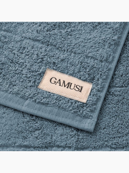 Serviette 100 % coton, éponge 600 g/m², avec boucle de suspension - Gamusi - Kiabi Serviette 100 % coton, éponge 600 g/m², avec boucle de suspension - Gamusi - Kiabi