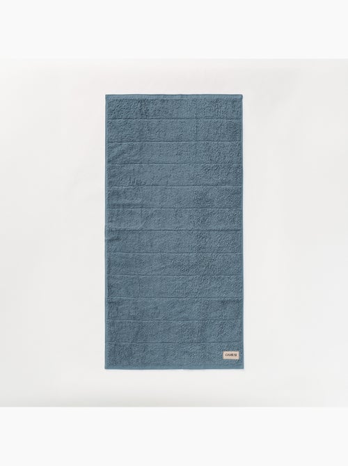 Serviette 100 % coton, éponge 600 g/m², avec boucle de suspension - Gamusi - Kiabi Serviette 100 % coton, éponge 600 g/m², avec boucle de suspension - Gamusi - Kiabi