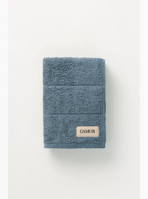 Serviette 100 % coton, éponge 600 g/m², avec boucle de suspension - Gamusi - Kiabi Serviette 100 % coton, éponge 600 g/m², avec boucle de suspension - Gamusi - Kiabi