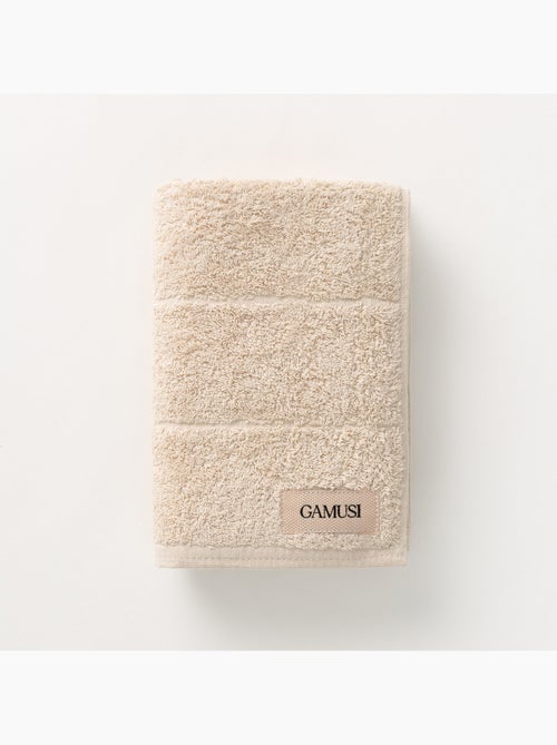Serviette 100 % coton, éponge 600 g/m², avec boucle de suspension - Gamusi - Kiabi Serviette 100 % coton, éponge 600 g/m², avec boucle de suspension - Gamusi - Kiabi