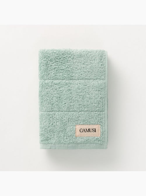 Serviette 100 % coton, éponge 600 g/m², avec boucle de suspension - Gamusi - Kiabi Serviette 100 % coton, éponge 600 g/m², avec boucle de suspension - Gamusi - Kiabi