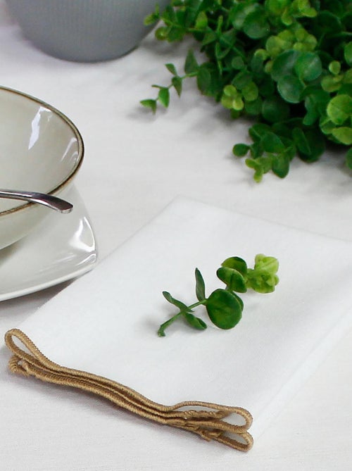 Serviette de table unie et bourdonnée - Kiabi Serviette de table unie et bourdonnée - Kiabi