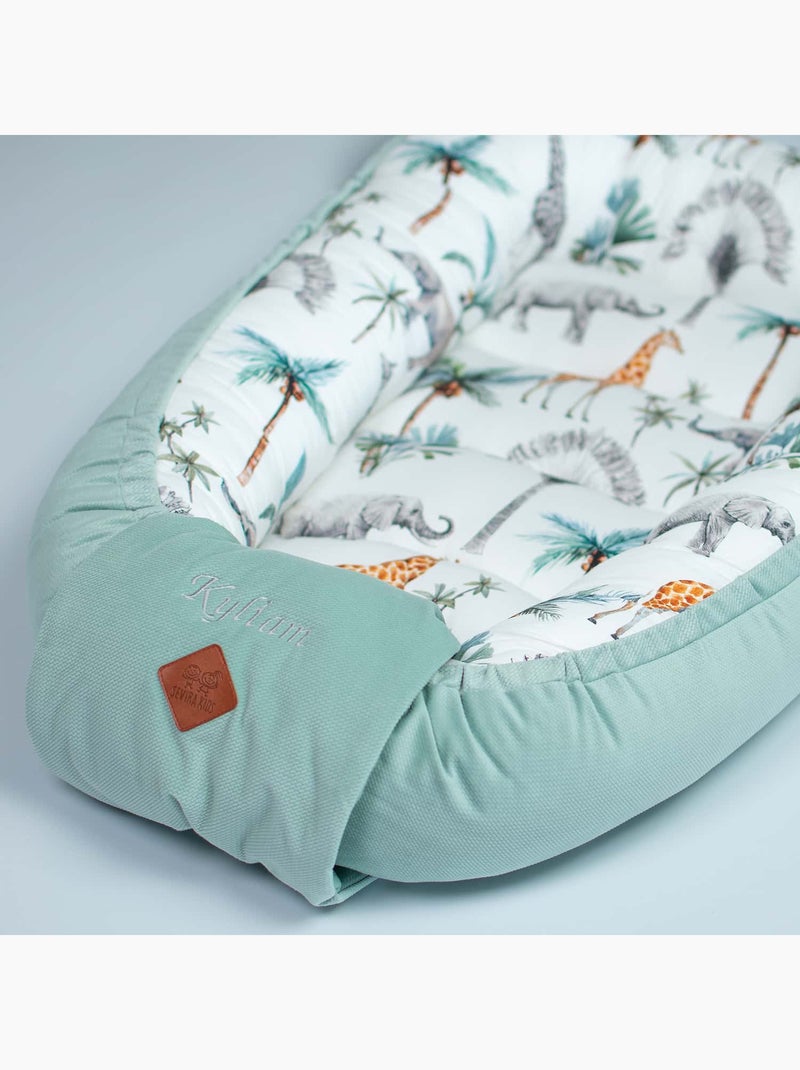 SEVIRA KIDS | Cocon nid bébé matelassé réducteur de lit Safari Vert d'eau - Kiabi