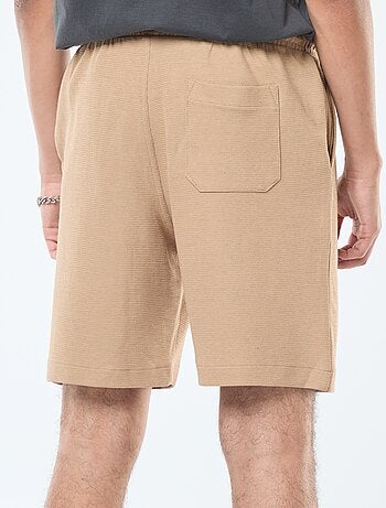 Short de sport avec poches en maille fantaisie