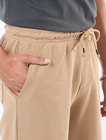 Short de sport avec poches en maille fantaisie