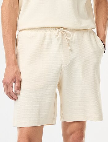 Short de sport avec poches en maille fantaisie