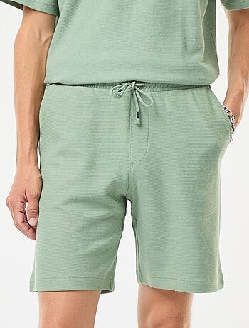 Short de sport avec poches en maille fantaisie