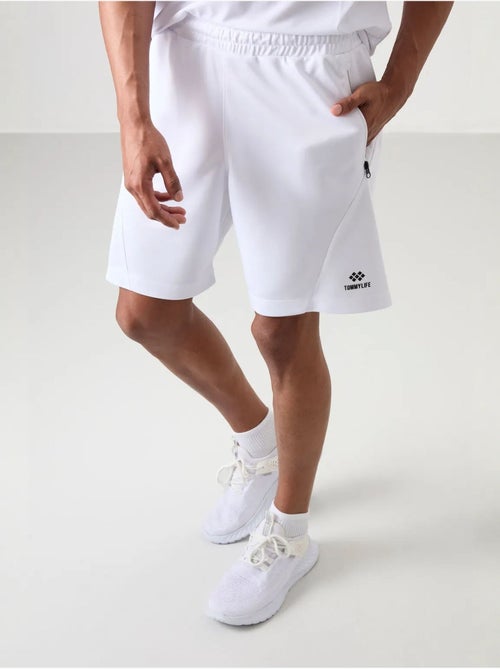 Short de survêtement homme à fermeture éclair tommy - Kiabi Short de survêtement homme à fermeture éclair tommy - Kiabi