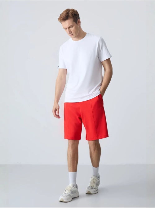 Short de survêtement homme en coton mélangé tommy - Kiabi Short de survêtement homme en coton mélangé tommy - Kiabi