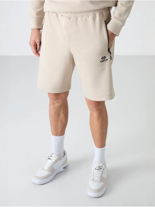 Short de survêtement homme en maille, coupe regular tommy - Kiabi Short de survêtement homme en maille, coupe regular tommy - Kiabi