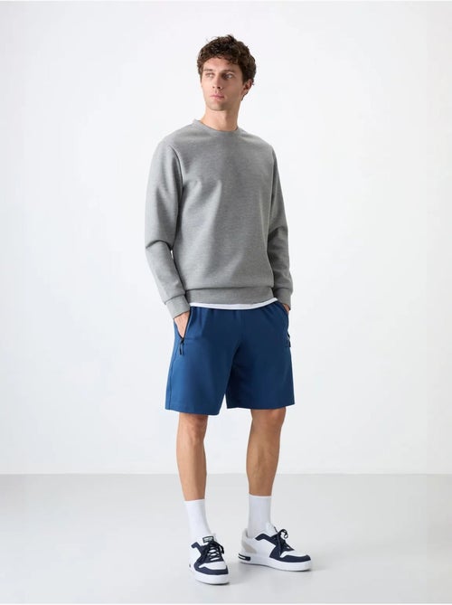 Short de survêtement homme en maille, coupe regular tommy - Kiabi Short de survêtement homme en maille, coupe regular tommy - Kiabi