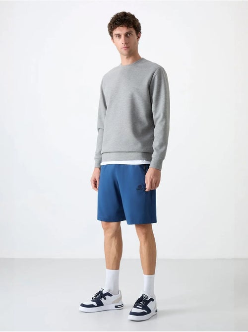 Short de survêtement homme en maille, coupe regular tommy - Kiabi Short de survêtement homme en maille, coupe regular tommy - Kiabi