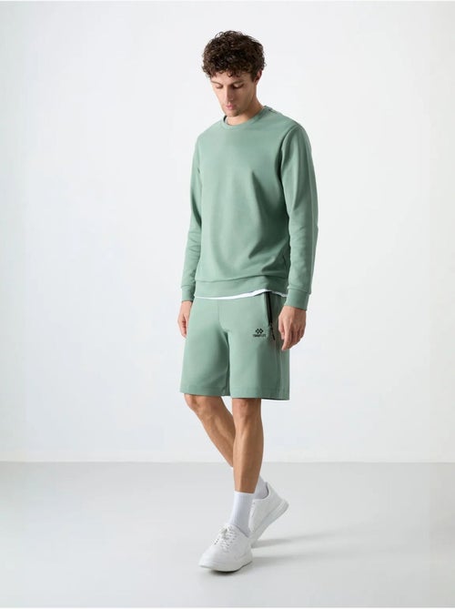 Short de survêtement homme en maille, coupe regular tommy - Kiabi Short de survêtement homme en maille, coupe regular tommy - Kiabi