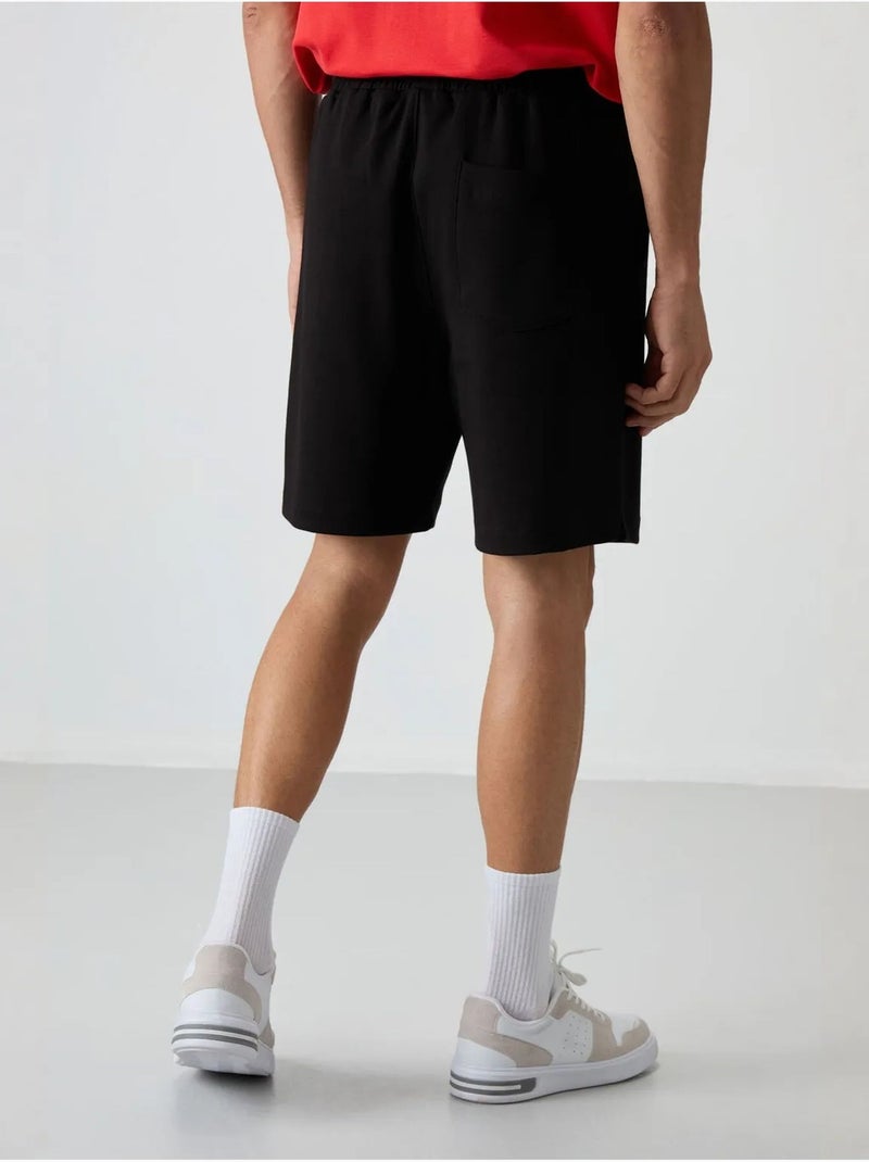 Short de survêtement homme en mélange de coton tommy Noir - Kiabi