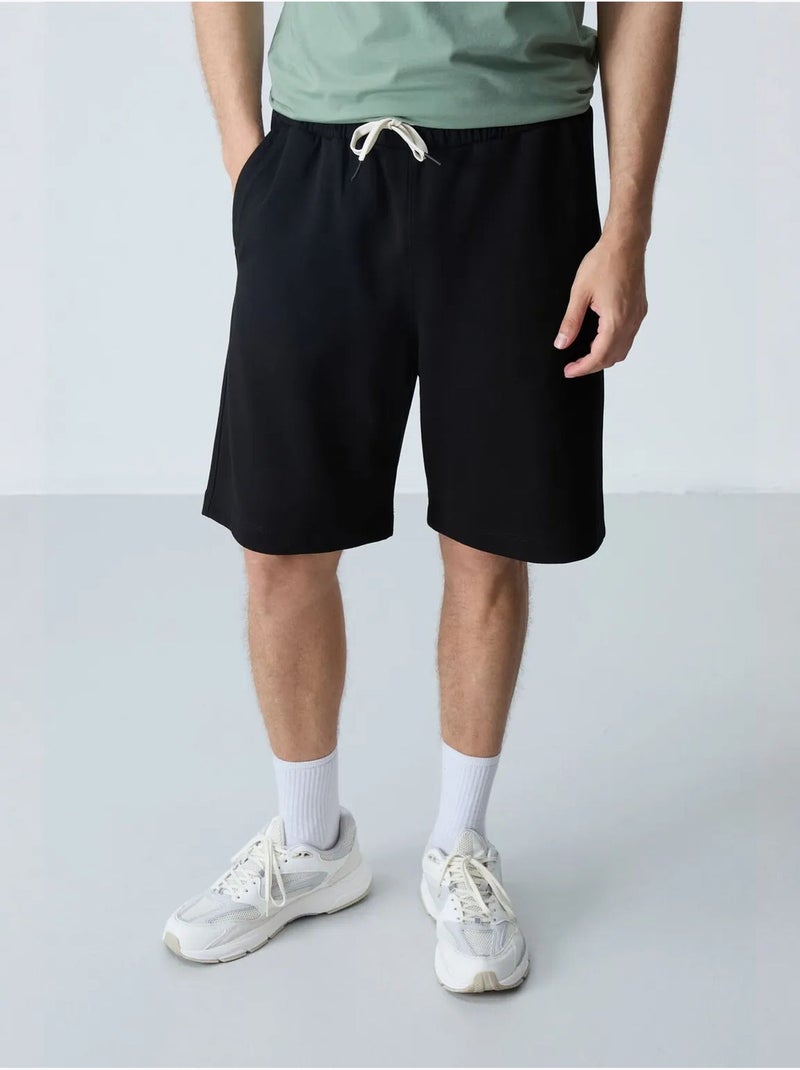Short de survêtement homme en mélange de coton tommy Noir - Kiabi