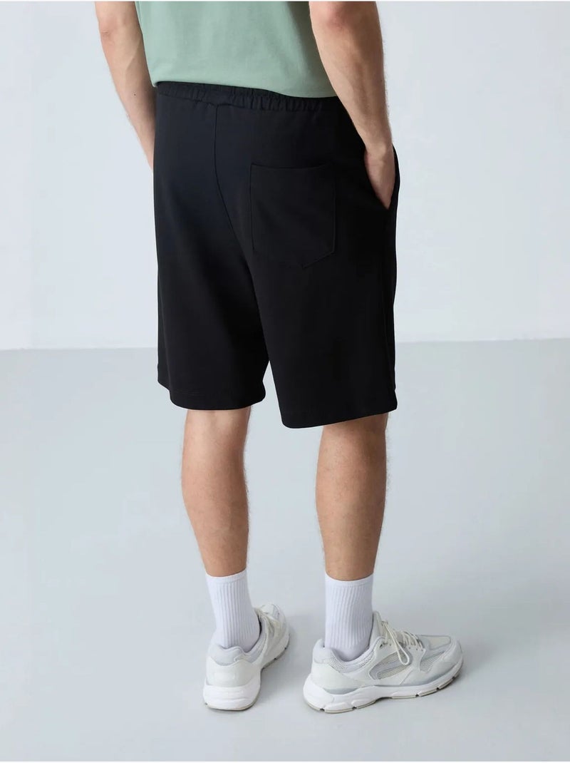 Short de survêtement homme en mélange de coton tommy Noir - Kiabi
