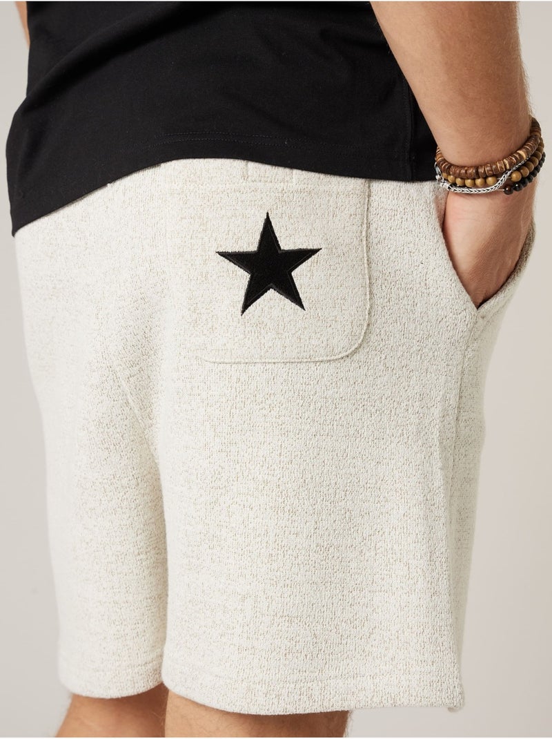Short jogger homme en french terry 'Deeluxe' Ecru - Kiabi