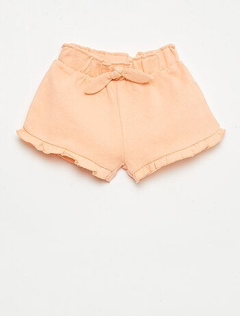 Short volanté avec nœud à la taille