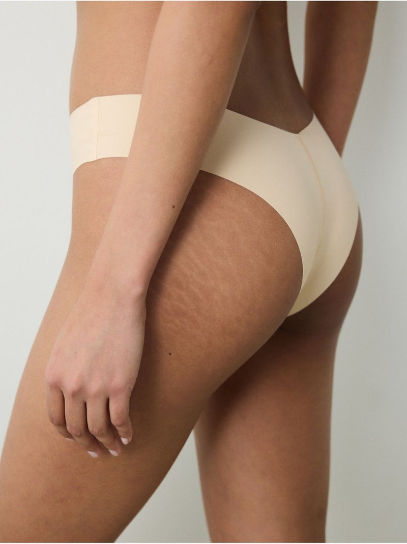 Slip brésilien invisible à découpe laser et forme en v penti Orange clair - Kiabi