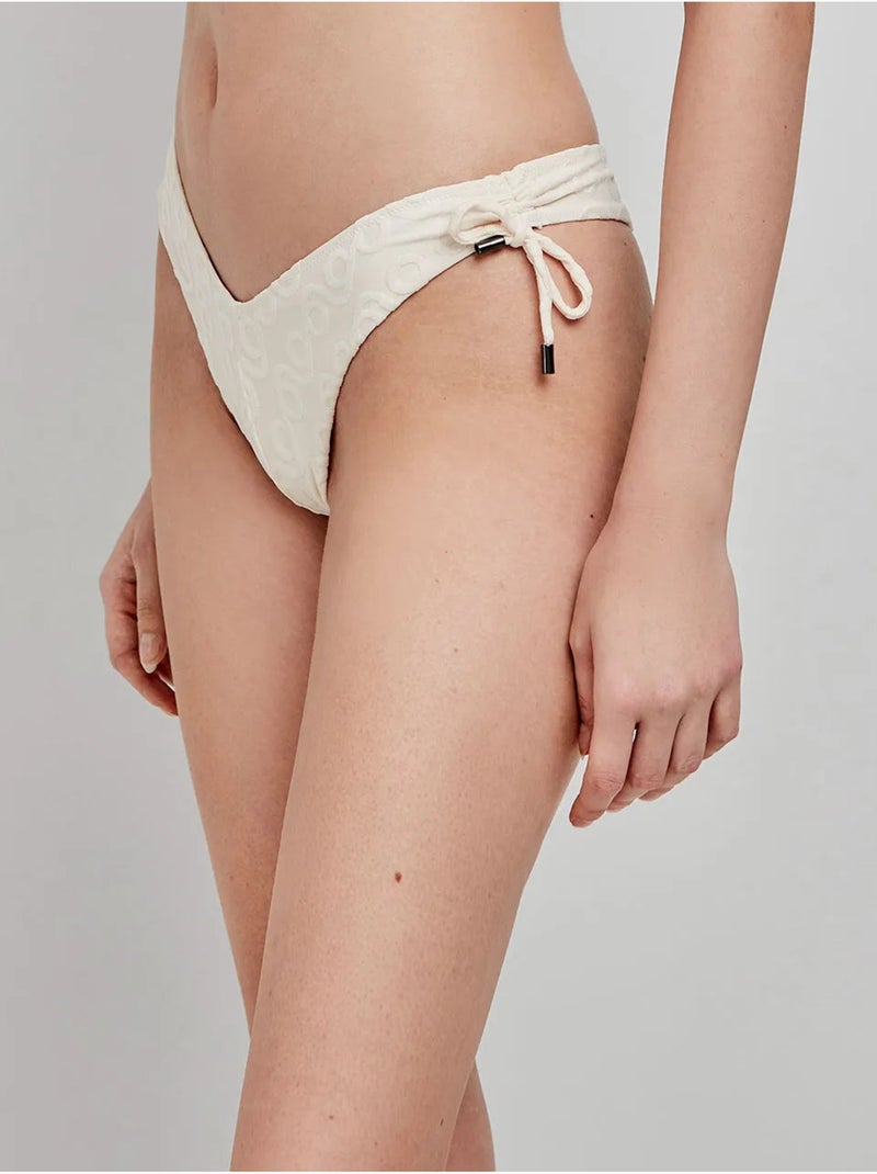 Slip de bikini brésilien avec coupe en v Beige - Kiabi