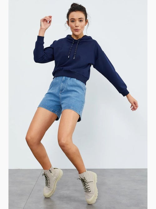 Sweat à capuche coupe décontractée avec lien tommy - Kiabi Sweat à capuche coupe décontractée avec lien tommy - Kiabi