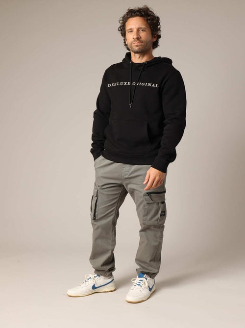 Sweat à capuche en polaire avec inscription brodée « DEELUXE ORIGINAL ». 'Deeluxe' - Kiabi Sweat à capuche en polaire avec inscription brodée « DEELUXE ORIGINAL ». 'Deeluxe' - Kiabi
