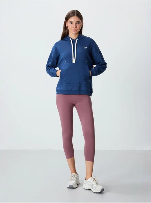 Sweat à capuche oversize avec poche tommy - Kiabi Sweat à capuche oversize avec poche tommy - Kiabi