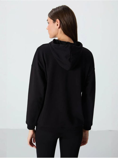 Sweat à capuche oversize avec poche tommy - Kiabi Sweat à capuche oversize avec poche tommy - Kiabi