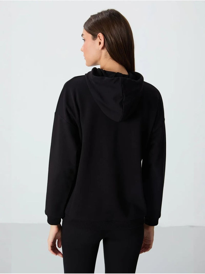 Sweat à capuche oversize avec poche tommy Noir - Kiabi