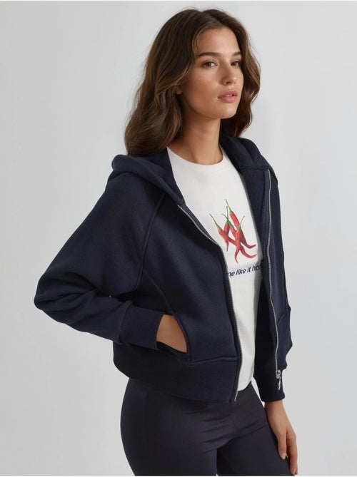 Sweat à capuche zippé coupe décontractée - Kiabi Sweat à capuche zippé coupe décontractée - Kiabi