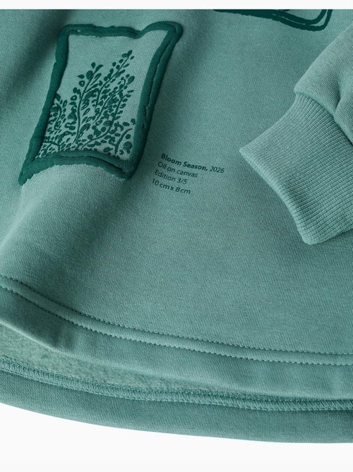 Sweat en coton peigné à capuche et imprimé floral - Kiabi Sweat en coton peigné à capuche et imprimé floral - Kiabi