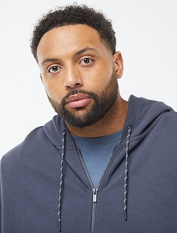 Sweat en maille piquée avec ouverture zippée et capuche