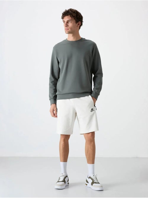 Sweat homme uni à col rond tommy - Kiabi Sweat homme uni à col rond tommy - Kiabi