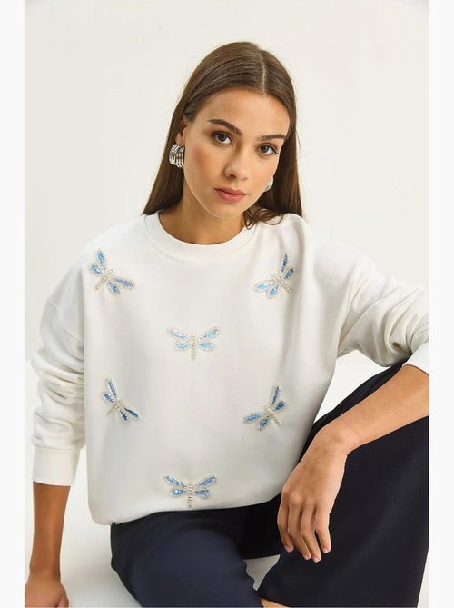 Sweat-shirt à col rond brodé de libellule lucci - Kiabi