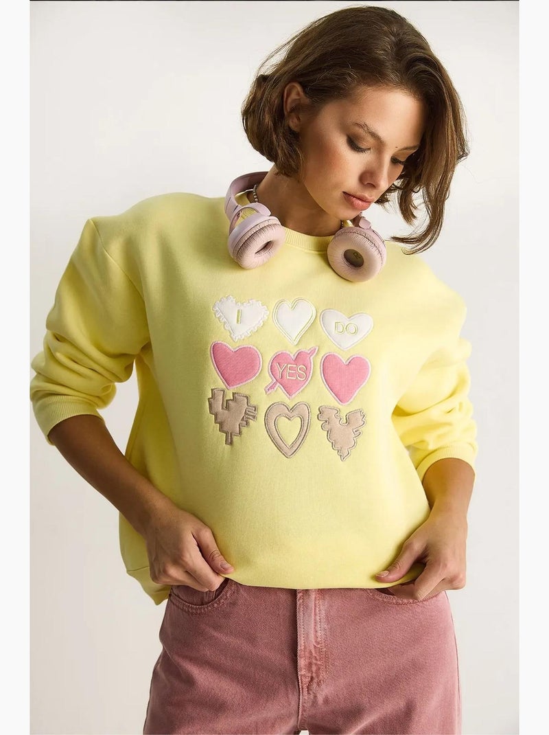 Sweat-shirt à col rond et coupe décontractée avec écusson cœur lucci Jaune citron - Kiabi