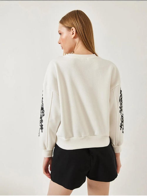 Sweat-shirt à manches brodées lucci - Kiabi Sweat-shirt à manches brodées lucci - Kiabi