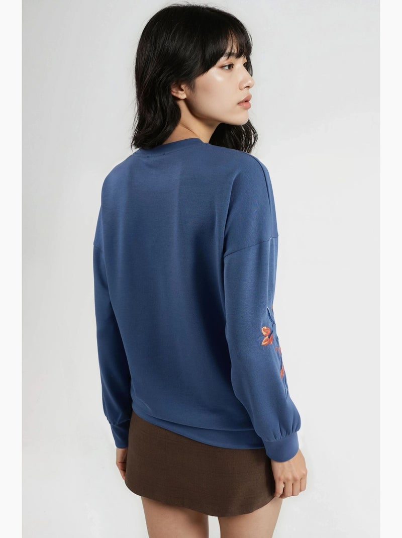 Sweat-shirt brodé à col rond et coupe confortable hiccup Bleu clair - Kiabi