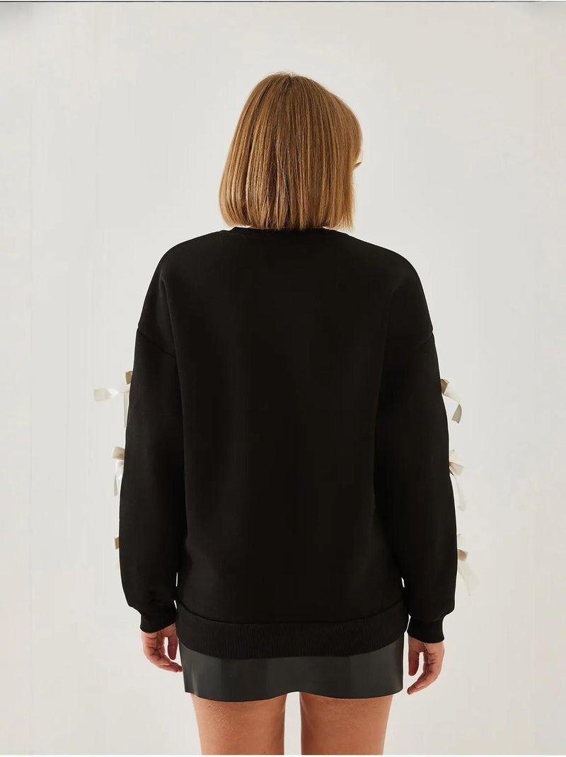 Sweat-shirt brossé trois fils bianco lucci avec manches à nœud Noir - Kiabi