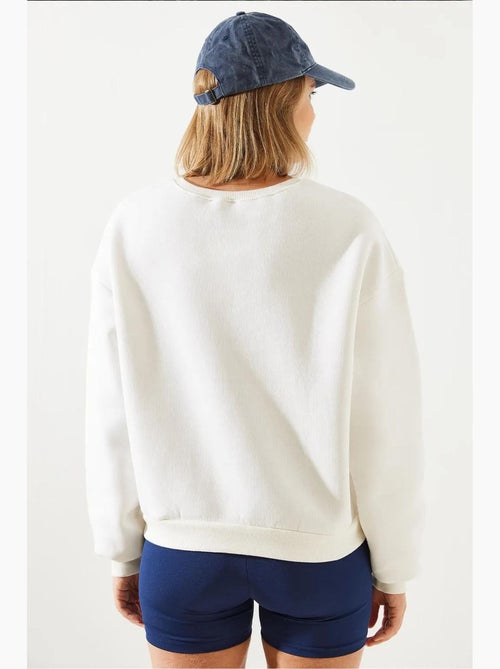 Sweat-shirt en fil brodé bianco lucci - Kiabi Sweat-shirt en fil brodé bianco lucci - Kiabi