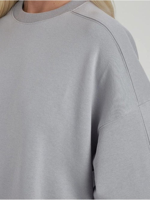 Sweat-shirt en tricot à col rond et coupe décontractée - Kiabi Sweat-shirt en tricot à col rond et coupe décontractée - Kiabi