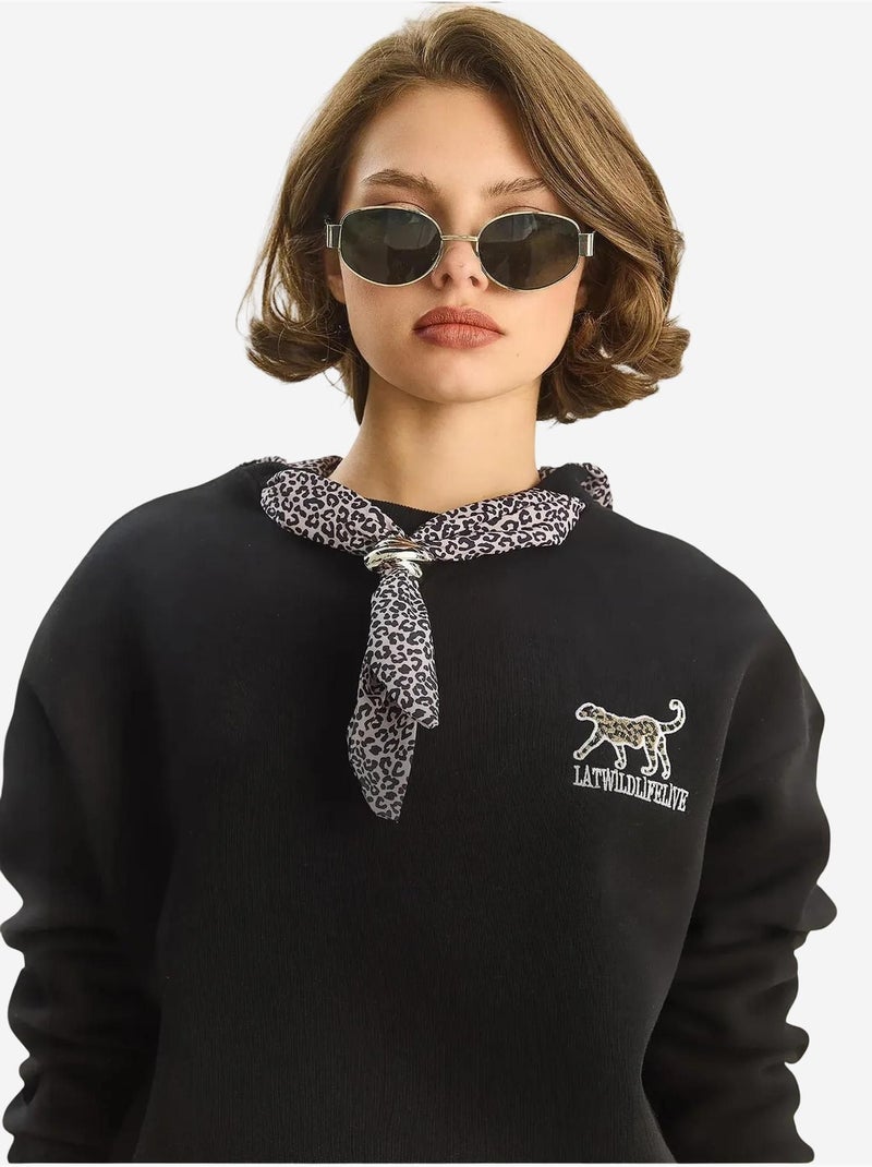 Sweat-shirt ras du cou brodé à imprimé léopard lucci Noir - Kiabi